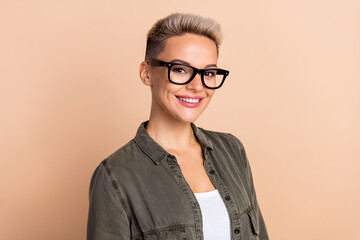 Portrait of young blonde short hairdo lady eyeglasses wear khaki shirt new profile linkedin picture isolated on beige color background