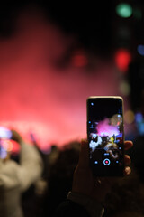 Mobile phone recording vertically video for social media sharing 