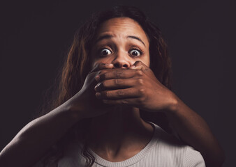 You wake up every morning to fight the same demons. Shot of a scared young womans mouth being...