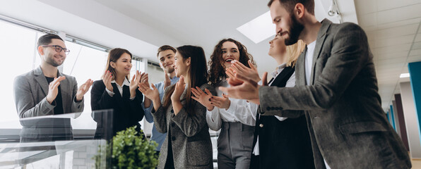 Multiracial group of business people clapping hands to congratulate their boss - Business company...