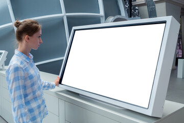 White screen, mock up, copyspace, template, technology concept. Woman in blue plaid shirt looking...