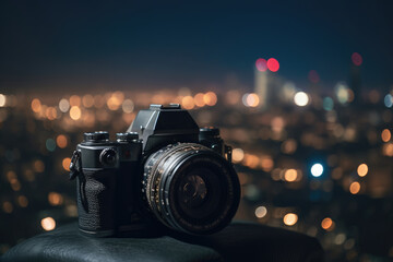 Fototapeta na wymiar Dslr camera in the front with bokeh effect of the cityscape in the background. Generative AI