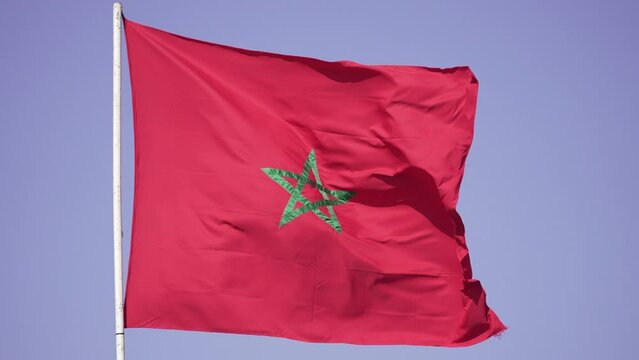 Pan on the moroccan flag waving in slow motion 