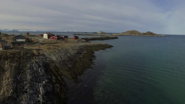 Drone footage of boat driving between islands
