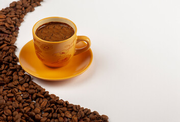 cup of turkish coffee and beans on white background