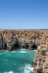 Fototapeta na wymiar landscape view of the atlantic ocean and caves and cliffs in Sagres Algarve Portugal 