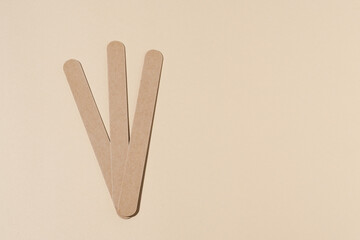 Three nail files on a natural beige isolated background with space for your design. Beauty product,...