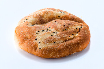 Fresh oriental flatbread with sesame seeds on a white background.