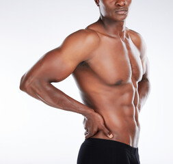 Fototapeta premium Muscles everywhere. Cropped shot of an unrecognisable man standing alone in the studio and posing shirtless.