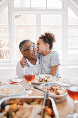 She gives the sweetest kisses. Shot of a young girl kissing her grandfather on the cheek during lunch.