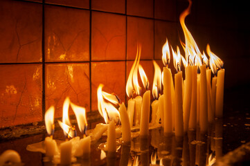 Fototapeta premium burning candles in the church