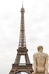 Fototapeta na wymiar Eiffel tower in Paris and statue