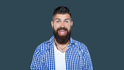 happy amazed bearded man wear checkered shirt on grey background