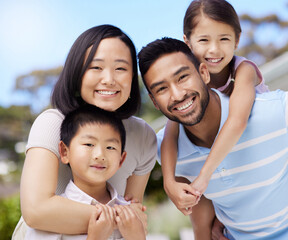 This is true happiness. Shot of a young family spending time together in their garden at home.