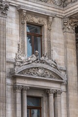 Architectural fragment of Brussels Stock Exchange building (BeursBourse) on the Place de la Bourse. The building erected from 1868 to 1873 in the Neo-Renaissance style. Brussels, Belgium.