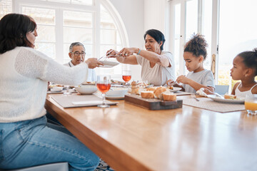 Sunday lunch has become a family tradition. Shot of a family having lunch together.