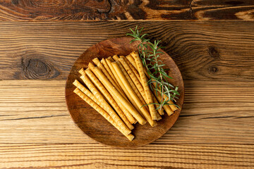 Bread Sticks on Wood Plate, Salted Breadstick, Crispy Grissini, Dry Homemade Pretzel on Wooden...