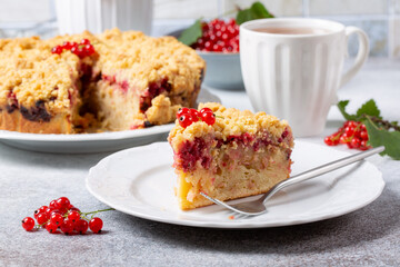 Homemade cake with berries on gray background. Yogurt pie with fresh red currant.