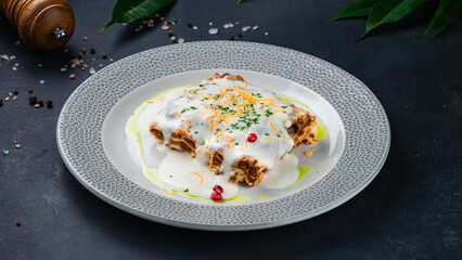 Italian lasagna with bechamel sauce, bolognese and greens.