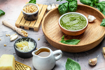 pesto sauce with ingredients Basil, olive oil, parmesan, garlic, pine nuts. banner, menu, recipe place for text, top view