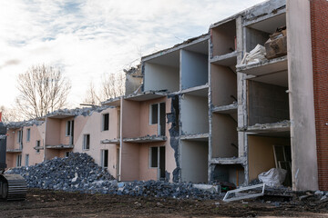 Demolition of low-rise residential building. Reconstruction, restoring damaged building. Destroyed...