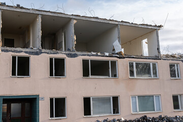 Demolition of low-rise residential building. Reconstruction, restoring damaged building. Destroyed...
