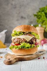 burger with meat on a light background