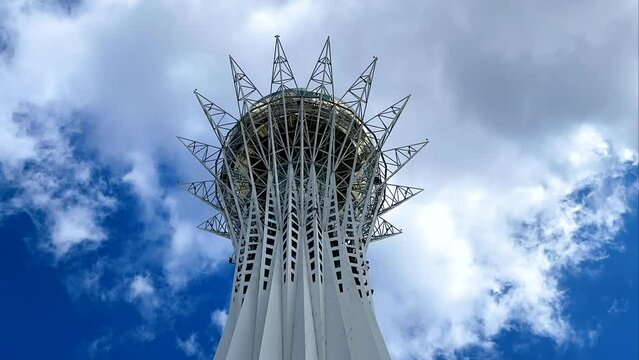 Astana, Kazakhstan, April 2023. Baiterek against a blue sky with clouds. Time lapse vertical video.
