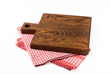 Cutting board with napkin isolated on white background.Handmade cutting board wood cutting board. Wooden board on a white background. MOCKUP. Design.