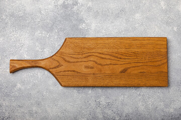 Cutting board on a textured marble kitchen table. Menu food card or recipes background concept.MOCKUP. Design. Place for text, copy space. The concept of food and cooking.