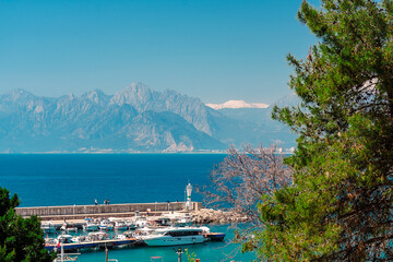 Aerial view of the port and the lighthouse in the Turkish city of Antalya. View of the port from...