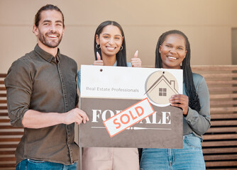 Successful homeowners. Shot of a young couple and their real estate agent holding up a sold board outside their house.