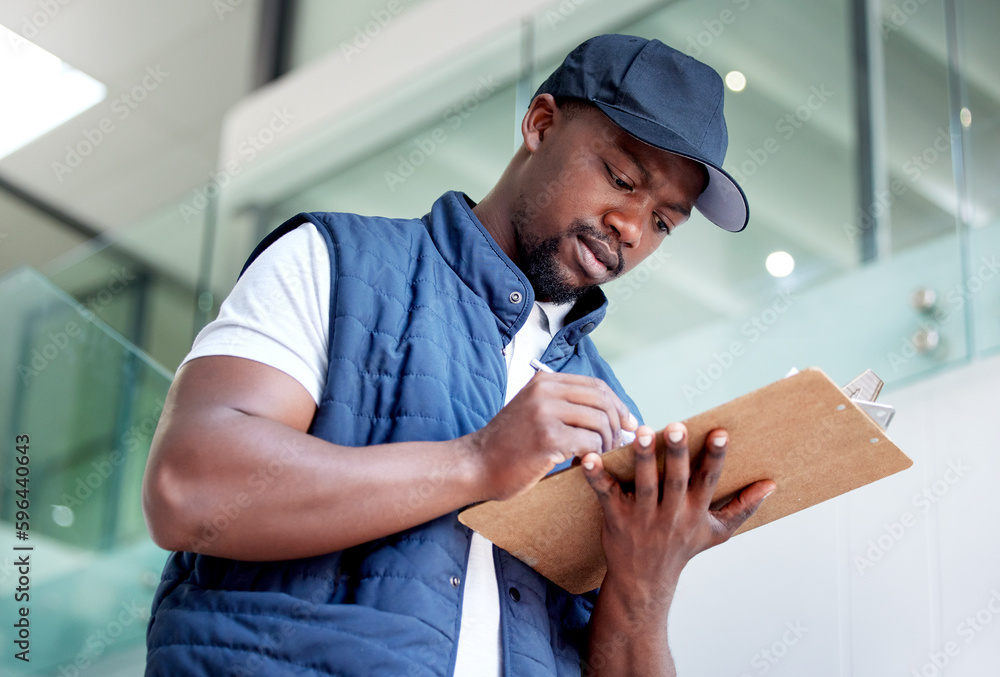 Poster Committed to delivering on time. Shot of a man delivering a package in a building.