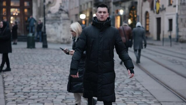 Disabled man, Amputee identity, Modern prosthetic. Street is being walked down by young man who has prosthetic leg and is disabled.
