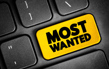 Fototapeta premium Most Wanted text button on keyboard, concept background