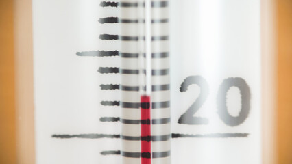 White thermometer on 22 degree close up
