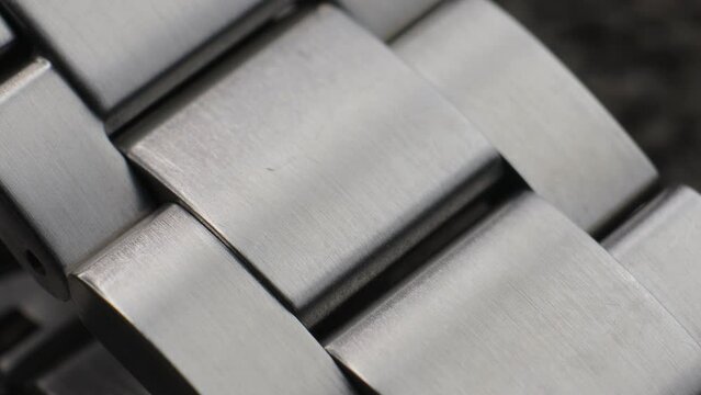 Macro close up of a steel metal professional watch strap in details 
