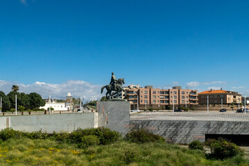 Oporto, Portugal. April 13 , 2022: Equestrian statue of D. Joao VI with blue sky.