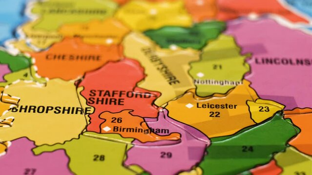 United Kingdom Puzzle Map with English Cities Leicester, Norwich, Birmingham. Close-Up Video Background, Dolly Footage. Selective Focus. Camera Moves From Left to Right.