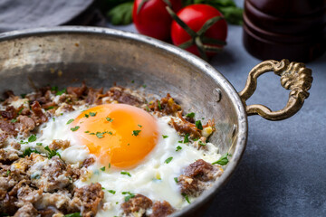 From traditional Turkish cuisine; fried eggs with meat. Turkish name; kavurmali yumurta