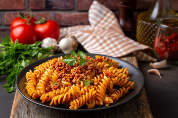 Fusilli pasta, spiral or spirali pasta with tomato, minced  sauce - Italian food style