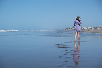 Woman walking by the beach