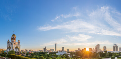 Panorama of spring or summer Yekaterinburg and Temple on Blood in orange sunset light. Yekaterinburg, Russia