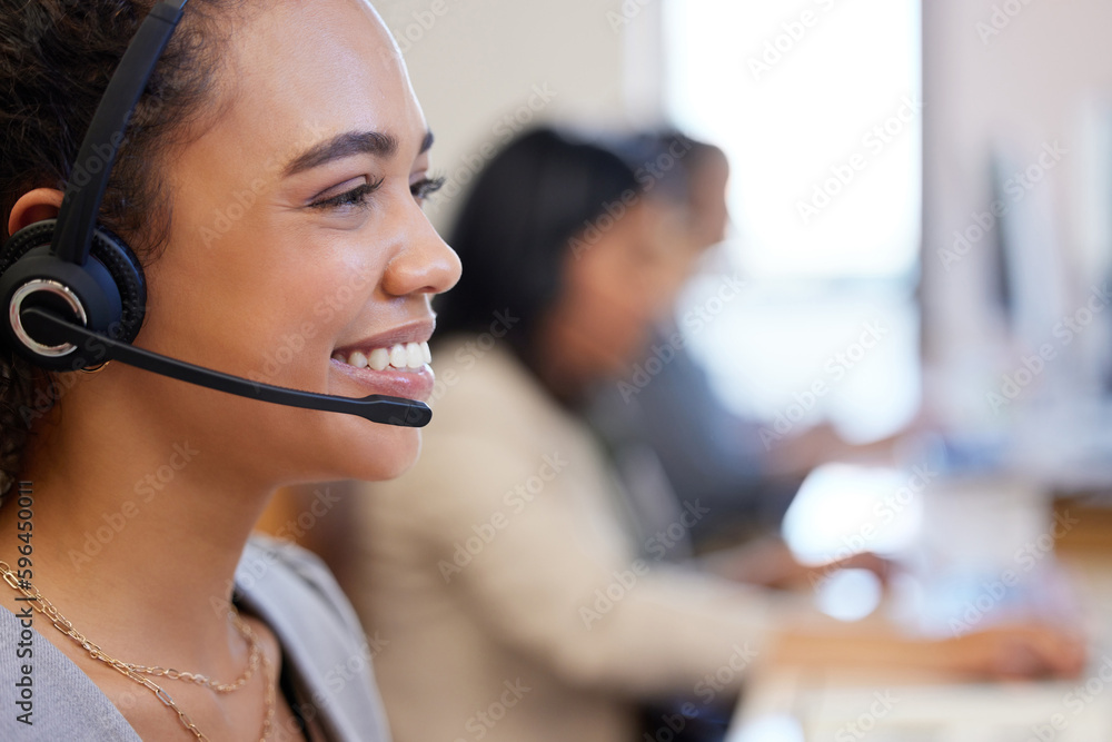 Poster friendly is the approach we always take. closeup shot of a young call centre agent working in an off