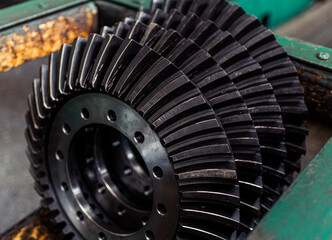Spur, helical and bevel gears construction and production. Rusted metal