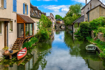 Eure River embankment with old houses in a small town Chartres, France