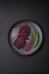 Delicious dried smoked beef or horse meat jerky with spices and salt