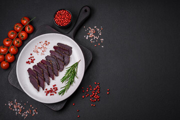 Delicious dried smoked beef or horse meat jerky with spices and salt