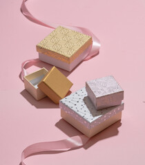 Gift box for jewelry on a pink background