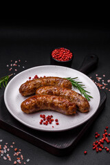 Delicious fried grilled sausages with salt, spices and herbs